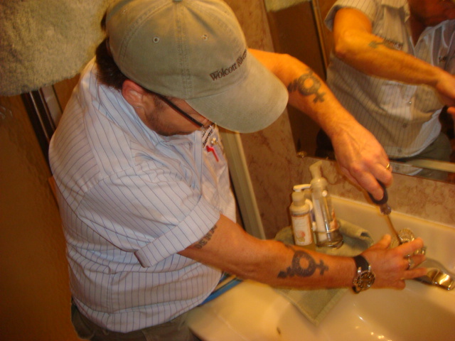 BJ Buchanan works on a client's sink, as an expert master plumber in Newport News, VA, across the Virginia Peninsula and Hampton Roads area. 